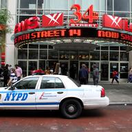Extra police are outside of New York City movie theaters on opening night of 'The Dark Knight Rises.' 