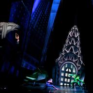 The theatrics in 'Spider-Man' are ambitious and larger than life. Here, Mary Jane hangs while Spider-Man and the Green Goblin duke it out with the Chrysler building in the backgronud.
