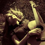 Summer: play a guitar in a park