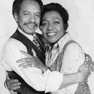 Publicity photo of American actors Sherman Hemsley and Isabel Sanford promoting their roles on the television series The Jeffersons.