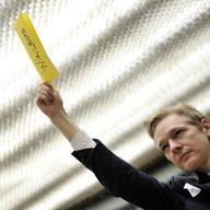 Wikileaks founder Julian Assange requests the floor during a meeting with U.S. State Department officials  on the sideline of a United Nations meeting in Geneva on Nov. 5, 2010