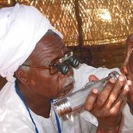 doctor performs eye exam