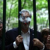 Bill Paley, the son of William Paley, now runs the luxury La Palina Cigars brand, smoking in Paley Park on the 44th anniversary of his family's park.