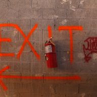 Well marked exit signs at the Deutsche Bank building in lower Manhattan where there are only a few stories left to demolish.