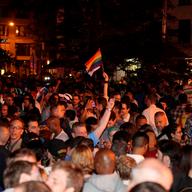 Hundreds gather outside of the Stonewall Inn to celebrate the passage of a same-sex marriage bill.