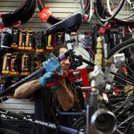 Hal Ruzil, a mechanic at Bicycle Habitat tuning up bikes
