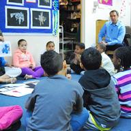 Artist Jeff Koons talks to second graders at P.S. 112 Jose Celson Barbosa about how to make paper animal sculptures to kick off Visual Arts Appreciation Week.