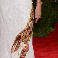 Editor-in-Chief of Vogue Anna Wintour considers the lobster with the dress she wore to the Met Museum Costume Institute Gala.