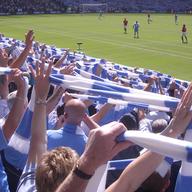 Manchester City fans celebrating by singing 'Blue Moon.'