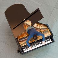 Pianist Amir Khosrowpour performs as part of <em>Stop, Repair, Prepare: Variations on “Ode to Joy” for a Prepared Piano</em> by Jennifer Allora and Guillermo Calzadilla.