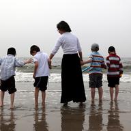 Mother with her children at Coney Island on Friday before Memorial Day.
