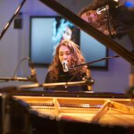 Regina Spektor performing in WNYC's Greene Space