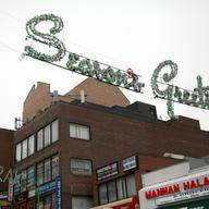 Jackson Heights celebrates the Muslim holiday of Eid al-Adha with salutations: "Seasons Greetings" and "Eid Muburak."