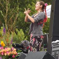 Woman signing at an indigo girls concert, sign language