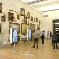 The reconfigured Robert H. and Clarice Smith New York Gallery includes multi-media installations at kiosks. The show introduces major themes of American history through stories and figures.