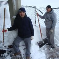 Two men clear snow from a Crown Heights walkway on January 27, 2011.