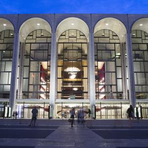  In this Aug. 1, 2014, file photo, pedestrians make their way in front of the Metropolitan Opera house at New York's Lincoln Center. On Sunday, Oct. 6, 2019, the Metropolitan Opera began regular Sunda