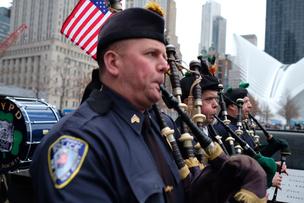 Members of the NYPD's Pipe's and Drum band circled the North Memorial Pool at the World Trade Center site to commemorate the 25th Anniversary of the 1993 World Trade Center bombing.