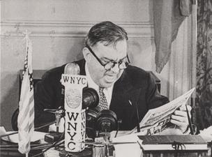 Mayor LaGuardia reads the comics over WNYC in July, 1945.