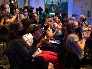 Audience claps during the performance