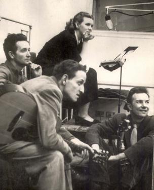 Jean Ritchie in the WNYC studios with Woody Guthrie, Peter Seeger, and Fred Hellerman. circa 1950