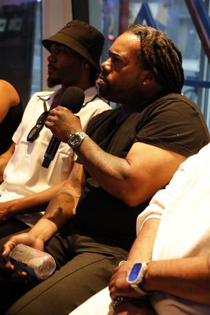 Audience member asks performers questions during Q and A session of The Old Man