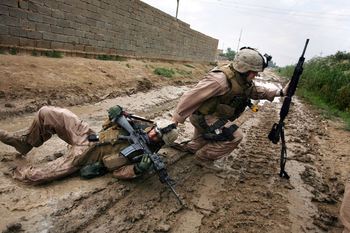 Karmah (Garma) October 31, 2006 - Sgt. Jesse E. Leach drags Lance Cpl. Juan Valdex of Weapons Company, 2nd Battalion, 8th Marines, to safety moments after he was shot by a sniper during a patrol. 