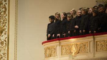 The Chicago Children's Choir, in the balcony, led by artistic director Josephine Lee.