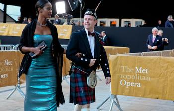 Patrons arrive on the red carpet at the Metropolitan Opera's opening night