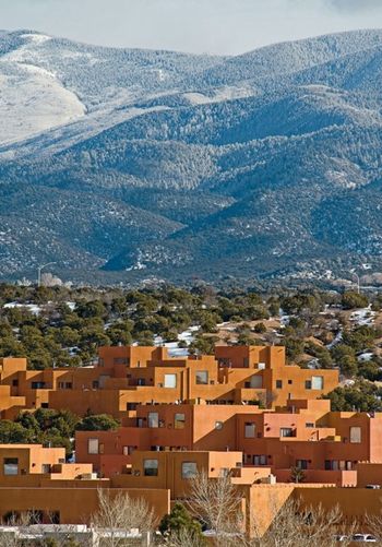 The Sangre de Cristo Mountains form a backdrop for residences designed by Ricardo Legorreta.