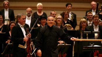 Stefan Sanderling, center, principal conductor with the Toledo Symphony at Carnegie Hall.