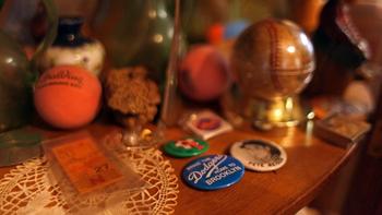 Pieces of Brooklyn's past: Spalding, Brooklyn Dodgers ticket, a baseball from the last Dodgers game and various pins
