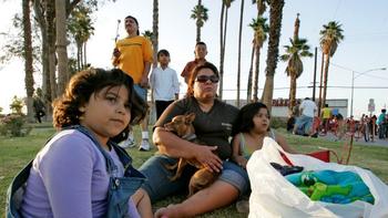 Mexicali residents sit on a grassy area just over the border after a 7.2 magnitude earthquake struck the area April 4.