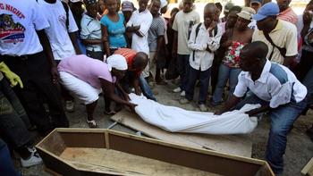 The body of Emanuela Aminise, an earthquake victim, is placed in a coffin.