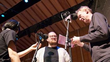 Dan Deacon and New Sounds Live host John Schaefer meeting and checking microphones before the performance from Merkin Concert Hall's Ecstatic Music Festival.