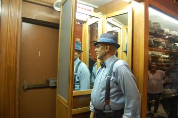 Rod Springer standing in the three-way mirror