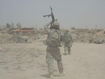 A fellow soldier took this shot of Wilkens, who was a machine gunner for his squad, getting his gun ready on a mission.