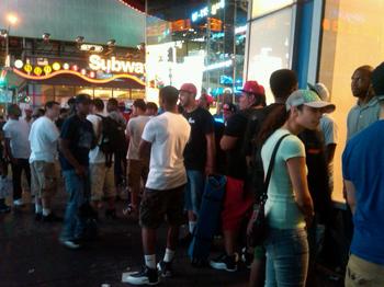 A line for sneakers snakes around the block.