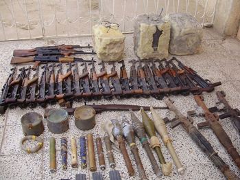 Wilkens took this shot of a cache of munitions his squad discovered during his second deployment in Iraq in the backyard of a house.