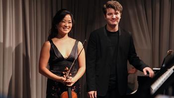 Violinist Chee-Yun and pianist Alessio Bax bowing following their live performance.