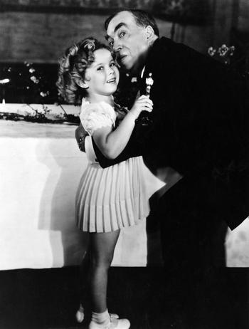 Shirley Temple, 1934 Special Award winner, with Irvin S. Cobb (The six-year-old actress starred in nine feature films in 1934).