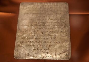 A silver plaque inscribed by Paul Revere, found in a 1795 time capsule, is displayed at the Museum of Fine Arts on January 6, 2015, in Boston, Massachusetts. 