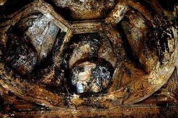 A picture taken on March 14, 2014 shows the burnt carvings in the temple of Baal at the ancient city of Palmyra in the ancient oasis city of Palmyra, 215 kilometres northeast of Damascus.