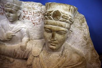A picture taken on March 14, 2014 shows a sculpture depicting a prince from the ancient Syrian oasis city of Palmyra, 215 kilometres northeast of Damascus, displayed at the city's museum. 