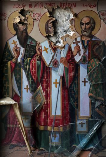 A picture taken on May 14, 2014 shows damaged icons inside the church of the monastery of Saint Takla in the ancient Christian town of Maalula.