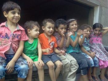 Children in Ghada Ageel's family singing.