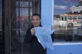 Andrew Lam outside his first apartment in America, in Daly City, just south of San Francisco. He's holding the shirt he was wearing as he escaped Saigon on April 28, 1975.