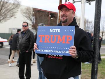 Supporters of Donald Trump rallied outside of his campaign event in Bethpage, Long Island. They faced off against more than 100 protesters on the other side of barriers.