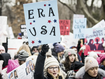 demonstrators holding signs in support of the Equal Rights Amendment 