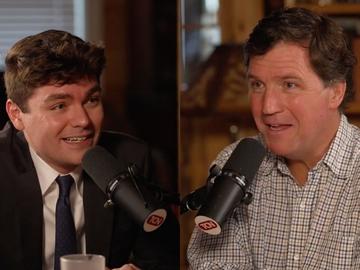 Nick Fuentes (left) speaking with Tucker Carlson (right) on The Tucker Carlson Show in late October 2025. 